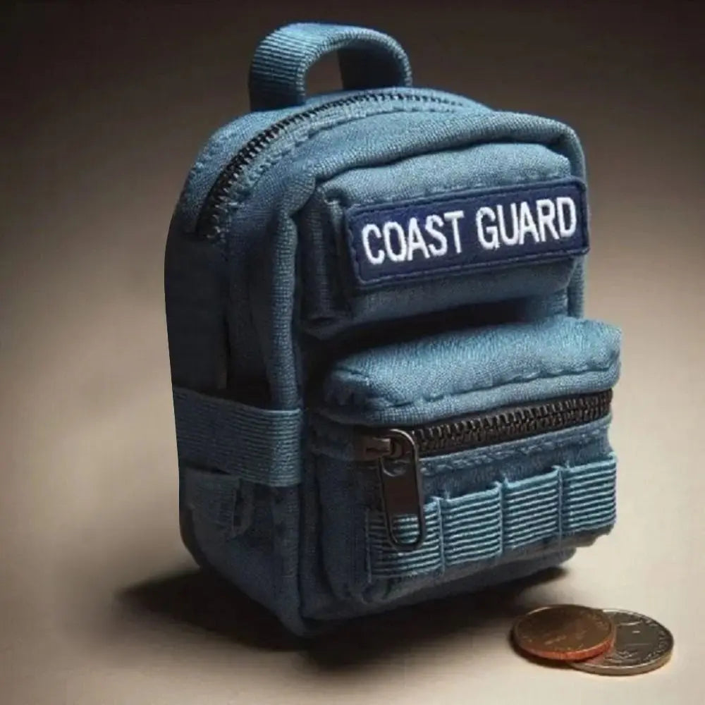 Blue backpack with 'Coast Guard' patch on a neutral background