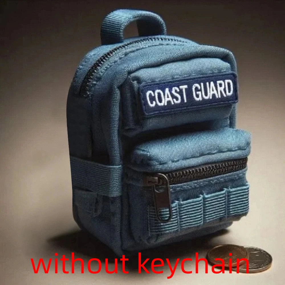 Blue mini backpack with 'Coast Guard' patch on a dark background