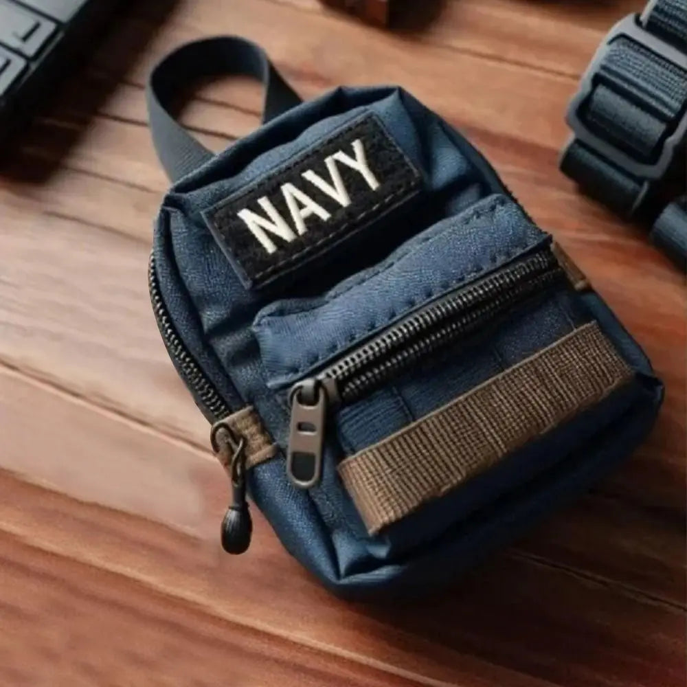 Blue pouch with 'Navy' patch on a wooden surface