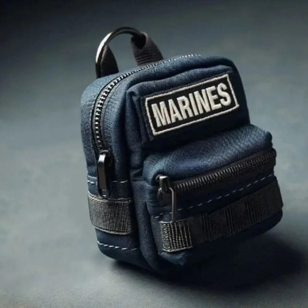 Small blue tactical pouch with 'MARINES' patch on a dark gray background