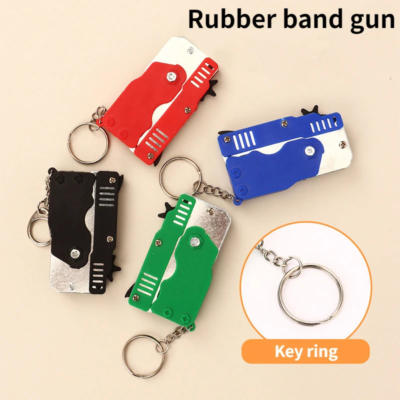 Mini folding rubber band gun keychain decoy toy