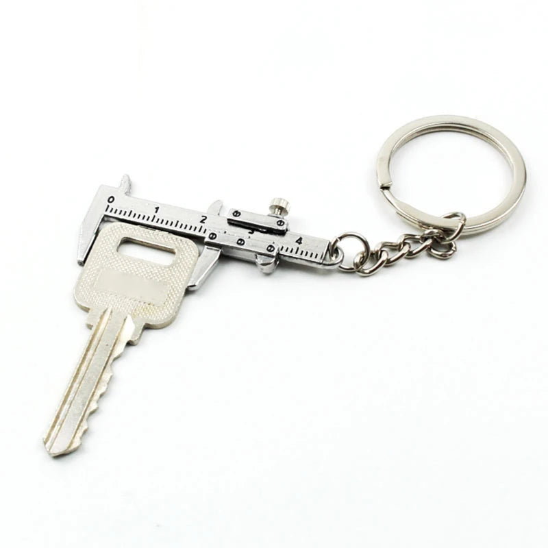 Keychain with a key and caliper design on a white background