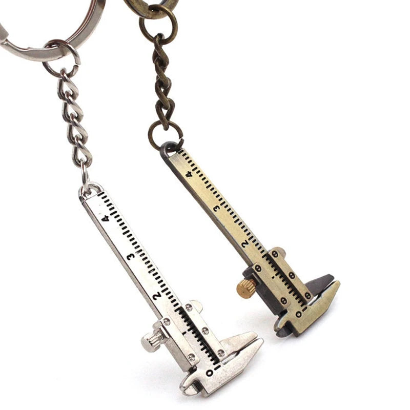 Caliper-shaped keychain on a white background