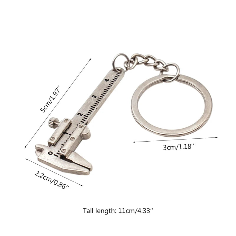 Silver caliper-shaped keychain with measurements on a white background