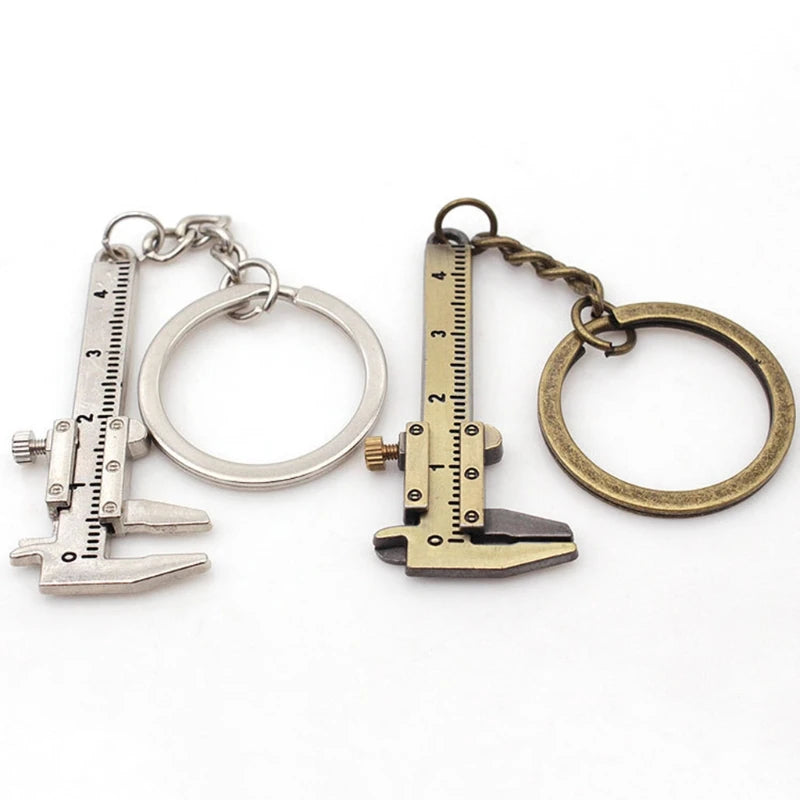 Two keychains with caliper designs on a white background