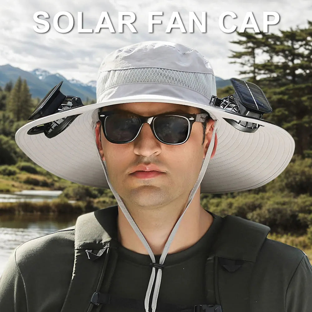 Person wearing a solar fan cap with a scenic background