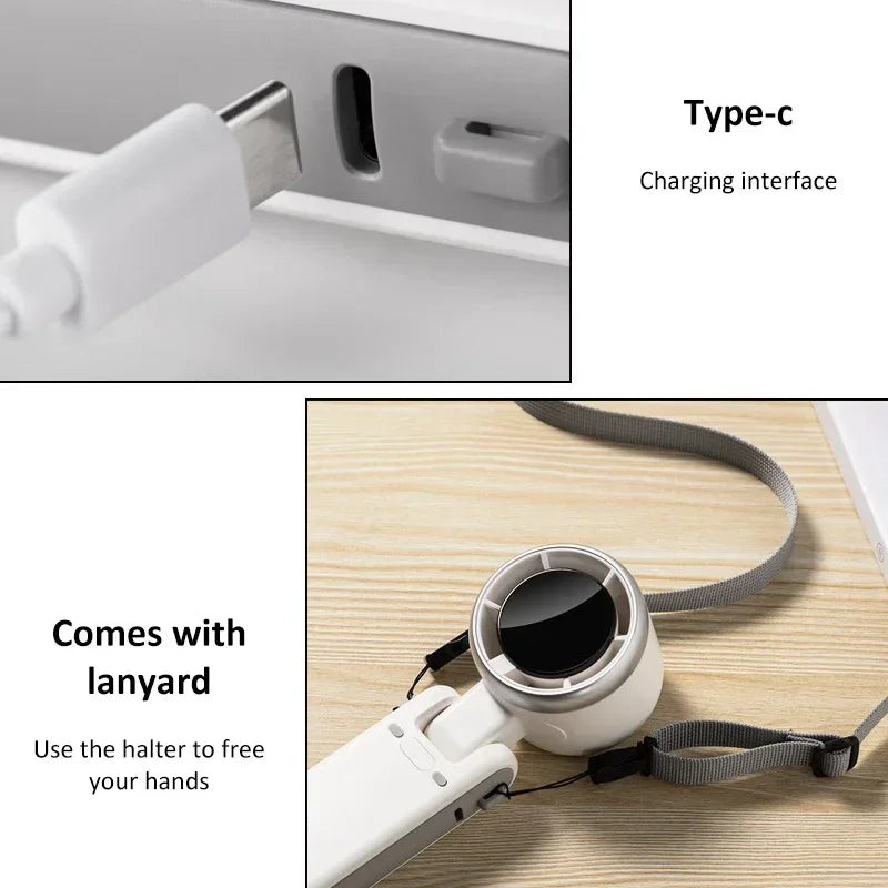 Hand fan with Type-C charging interface and lanyard on a wooden surface