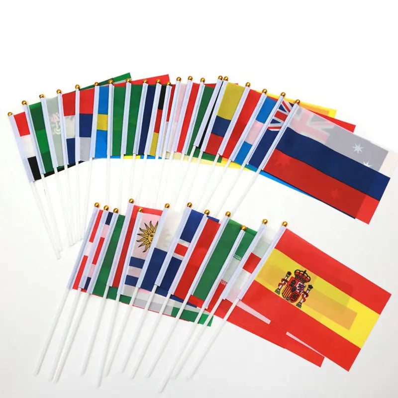 Collection of various country flags on sticks against a white background
