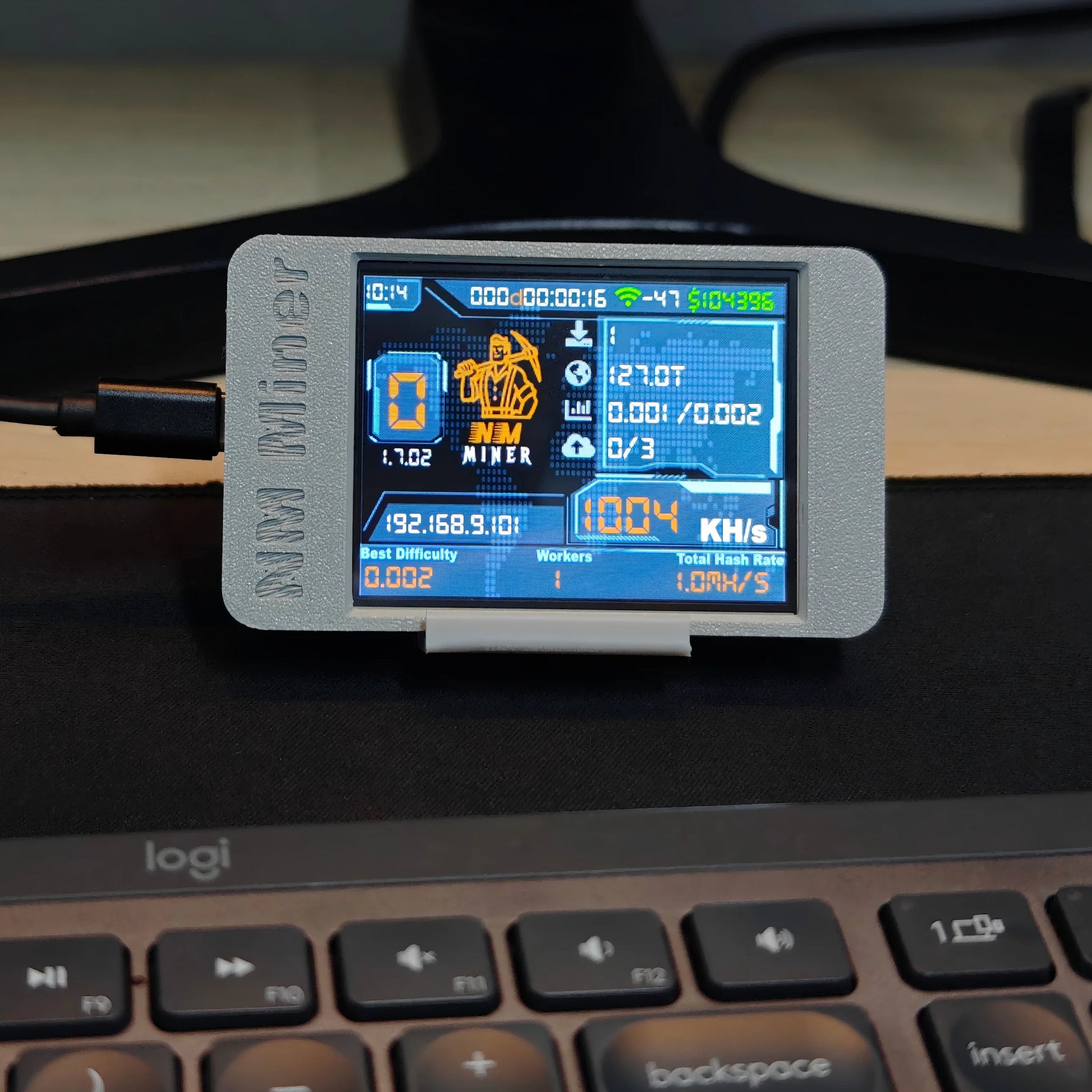 NMMiner NerdMiner V2 ESP32-2432S028R featuring a 2.8-inch smart display showing 1000KH/s Bitcoin lottery hashrate.