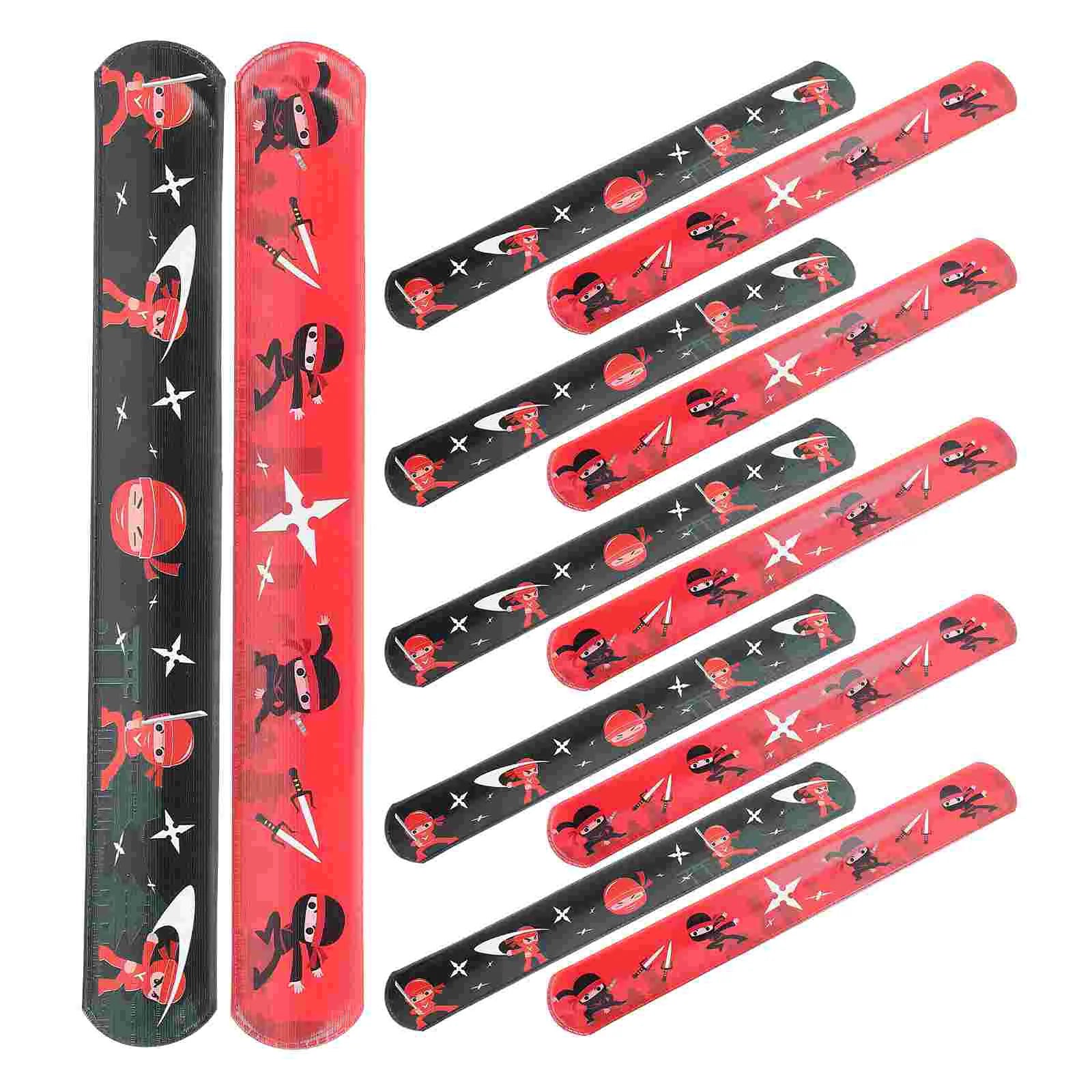 Set of red and black slaps band slap bracelets with ninja design on a white background