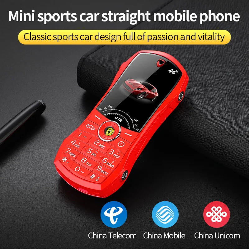 Red mini sports car-shaped mobile phone on a dark surface with text and logos.