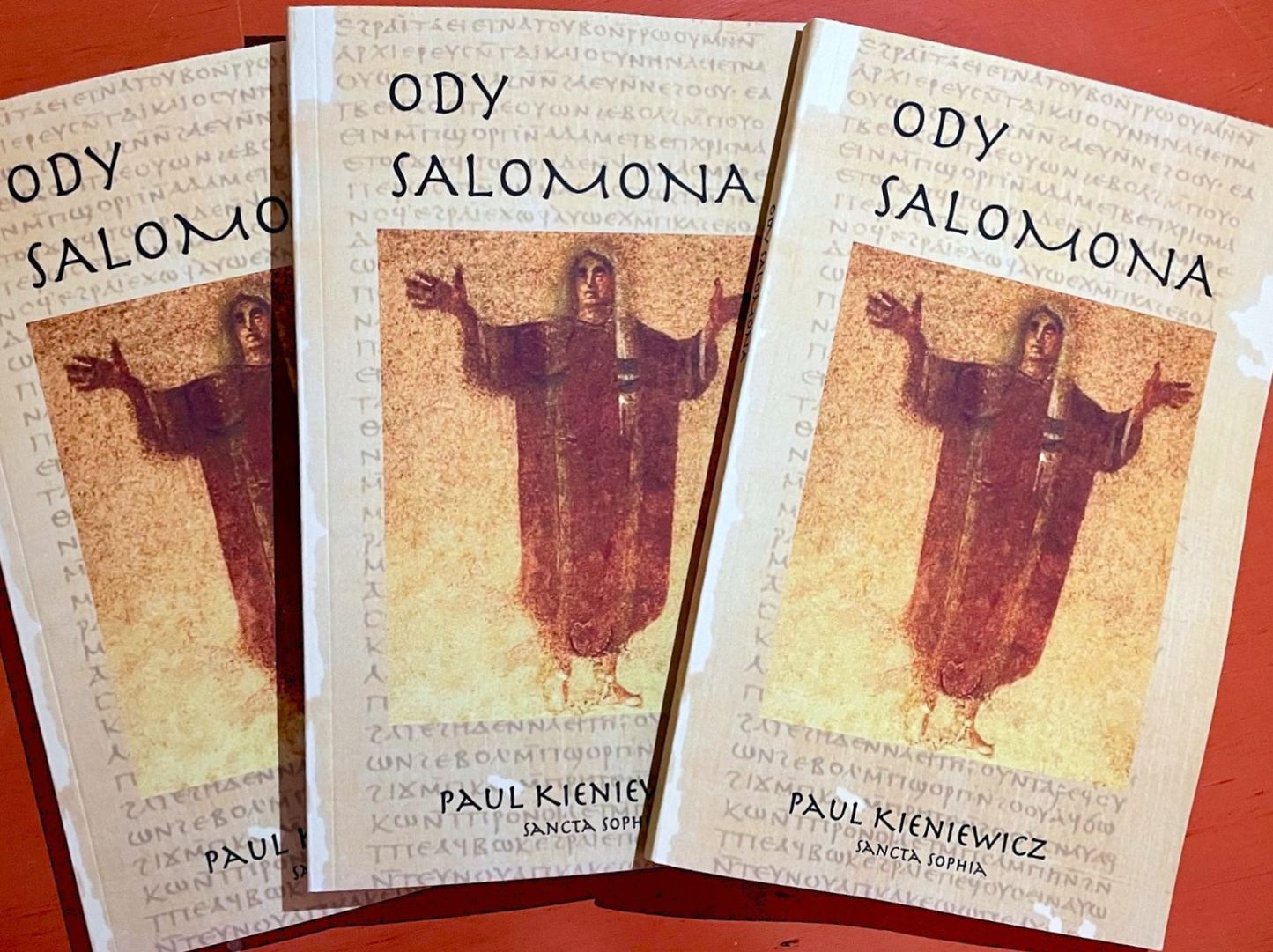 Three-book display of "Ody Salomona" in an accordion-style overlap, showcasing the uniform papyrus design and Gnostic Gospel cover art for "Ody Salomona [Sancta Sophia] by Paul Kieniewicz