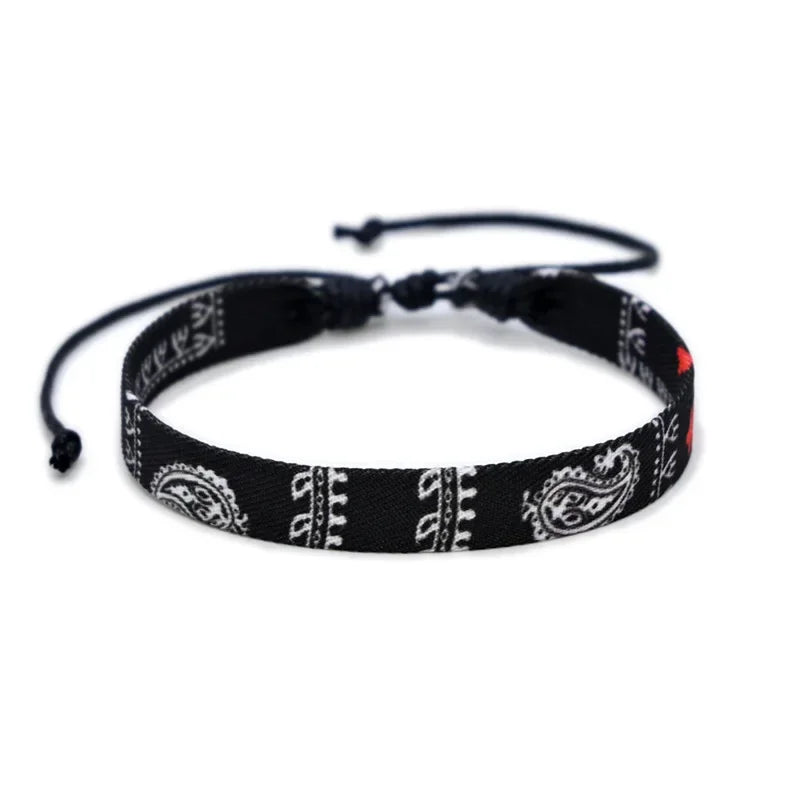 Black bandana-style headband with white patterns on a white background