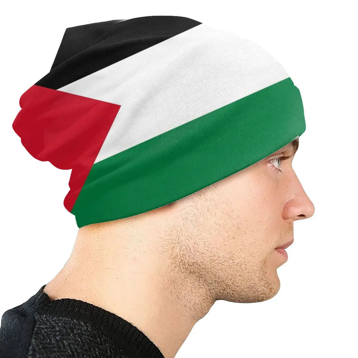 Person wearing a Palestinian flag Palestine Gaza skullie knitted ski cap headwear skull-cap in the black, white, and green and red from the Palestinian flag beanie skull-cap on a white background.