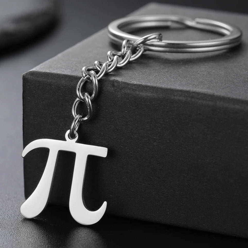 Keychain with pi symbol on a black surface
