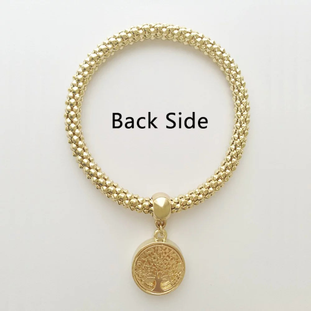 A gold-colored bracelet featuring a circular pendant with the Polish flag colors and the Polish eagle emblem. Image displaying back side of bracelet and charm.