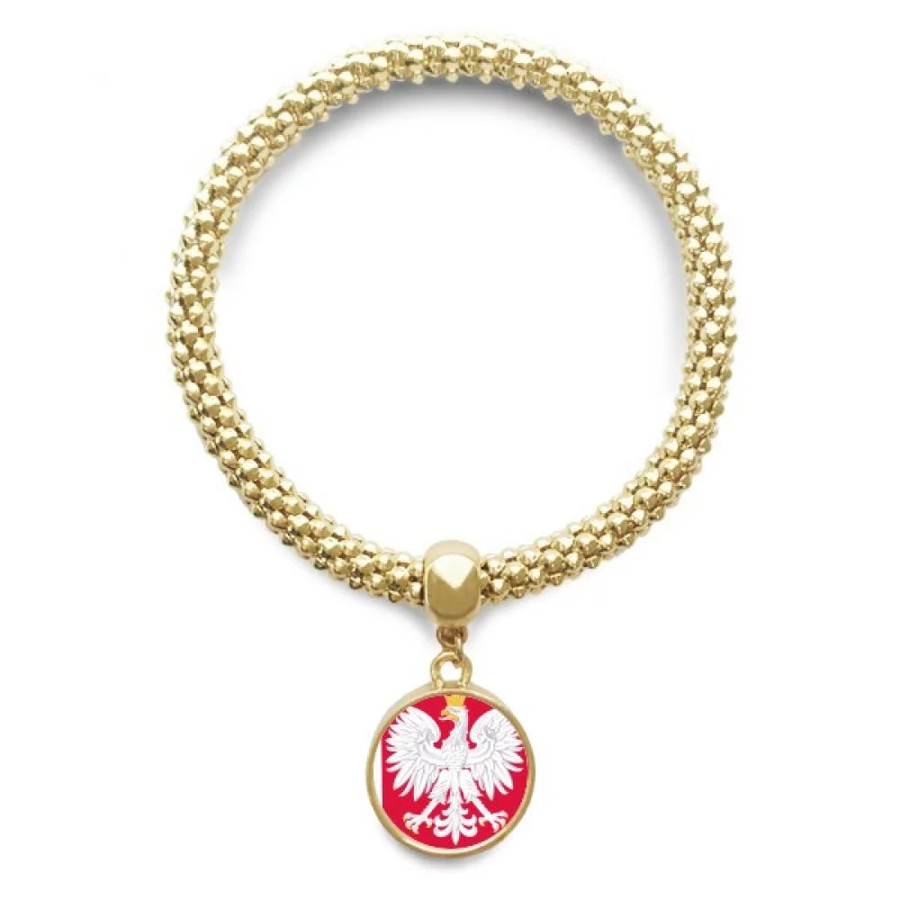 A gold-colored bracelet featuring a circular pendant with the Polish flag colors and the Polish eagle emblem.