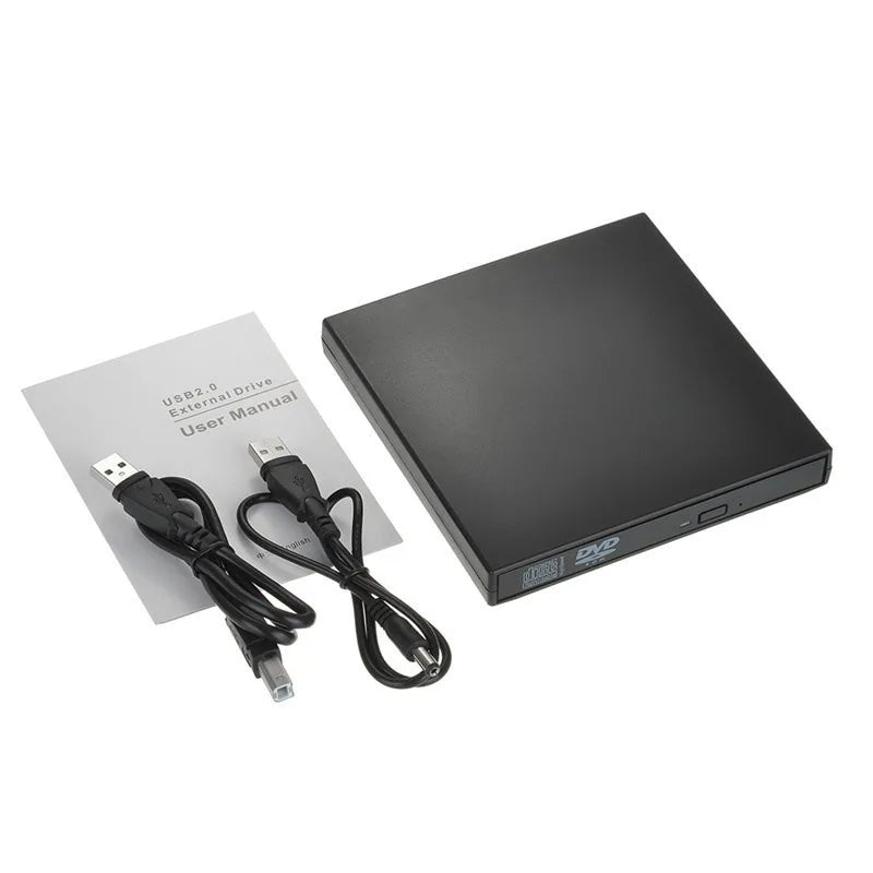 External DVD drive with USB cable and user manual on a white background