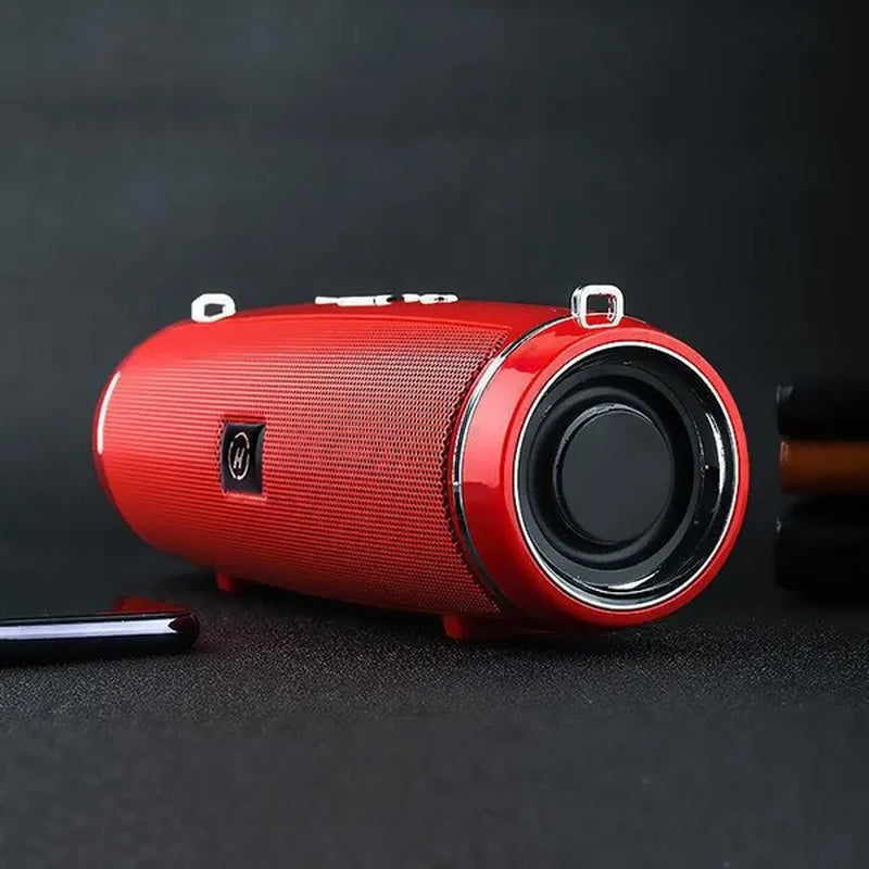 A red waterproof portable speaker advertised with various features such as Bluetooth 5.1 connectivity, 360-degree surround sound, and a double horn for enhanced bass.