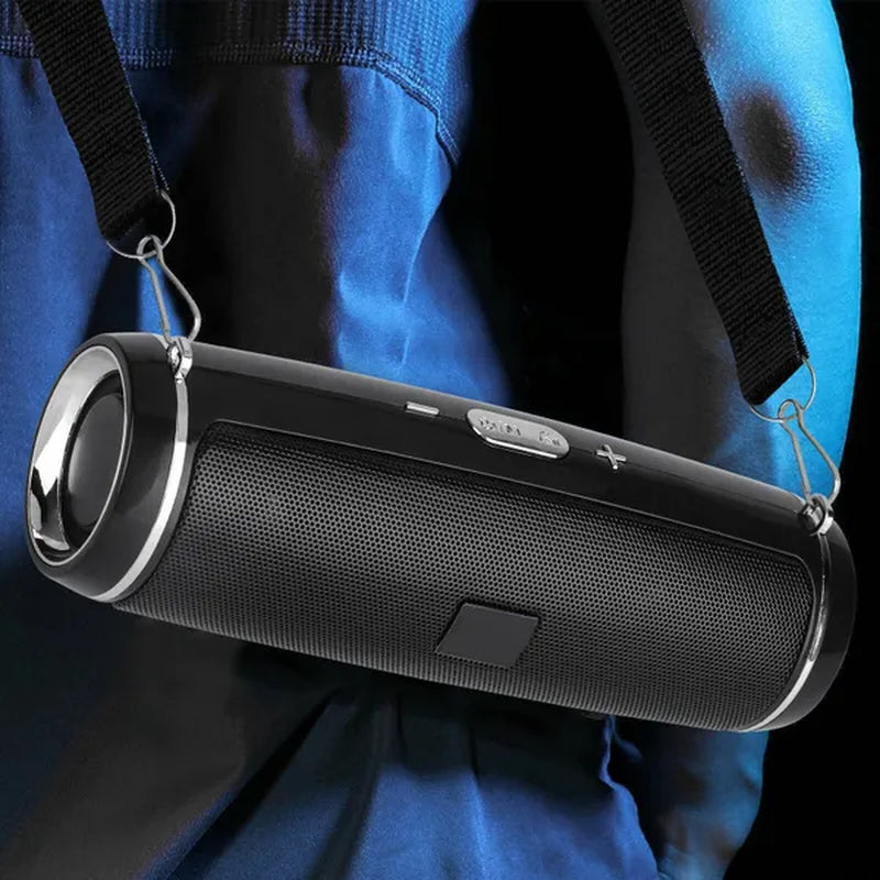 A waterproof portable speaker advertised with various features such as travel strap, Bluetooth 5.1 connectivity, 360-degree surround sound, and a double horn for enhanced bass.