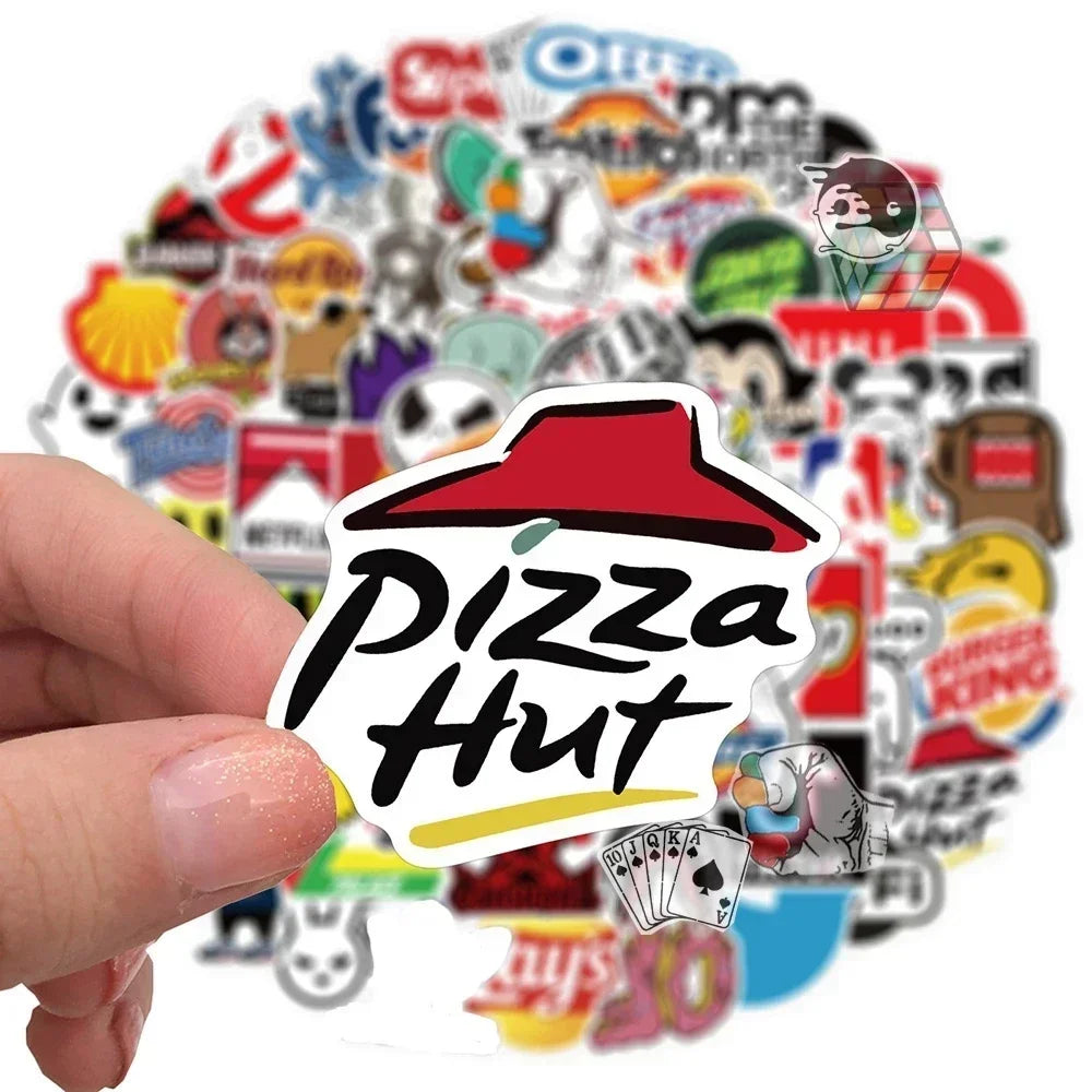 Hand holding a Pizza Hut sticker with various other logos in the background