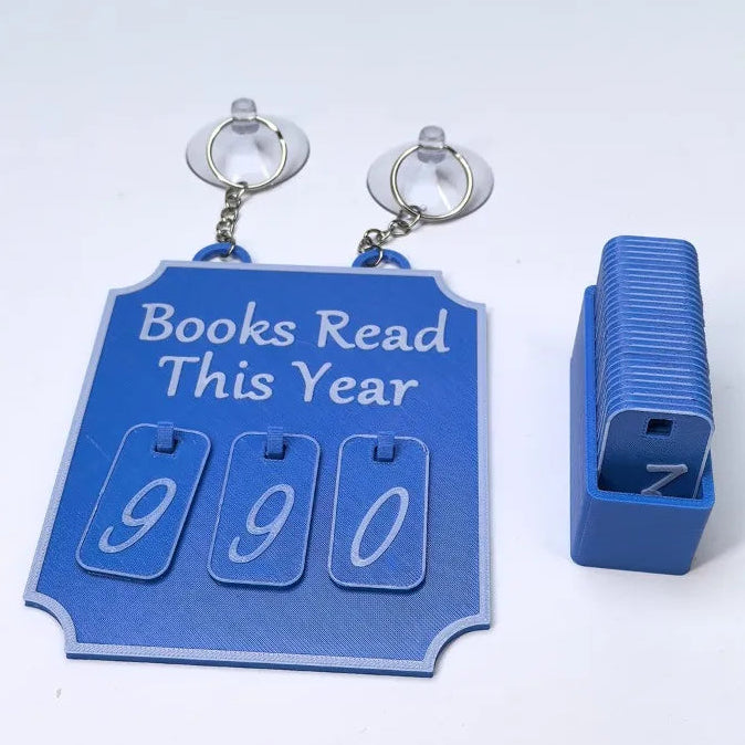 Blue book tracker with 'Books Read This Year' text on a white background