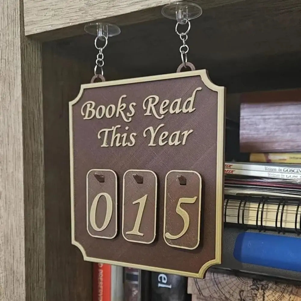 Decorative sign counting books read this year on a bookshelf.