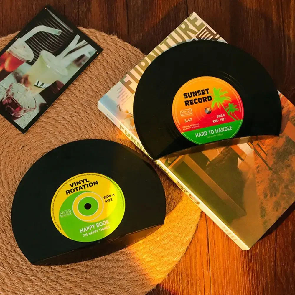 Retro vinyl record bookends facing out from book collection displaying unique labels.