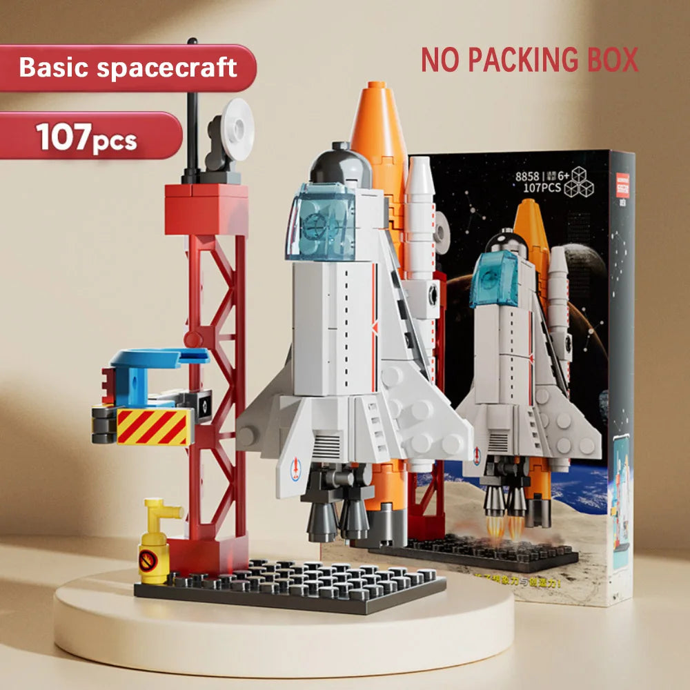 Toy spacecraft set with launch tower and packaging on a beige background