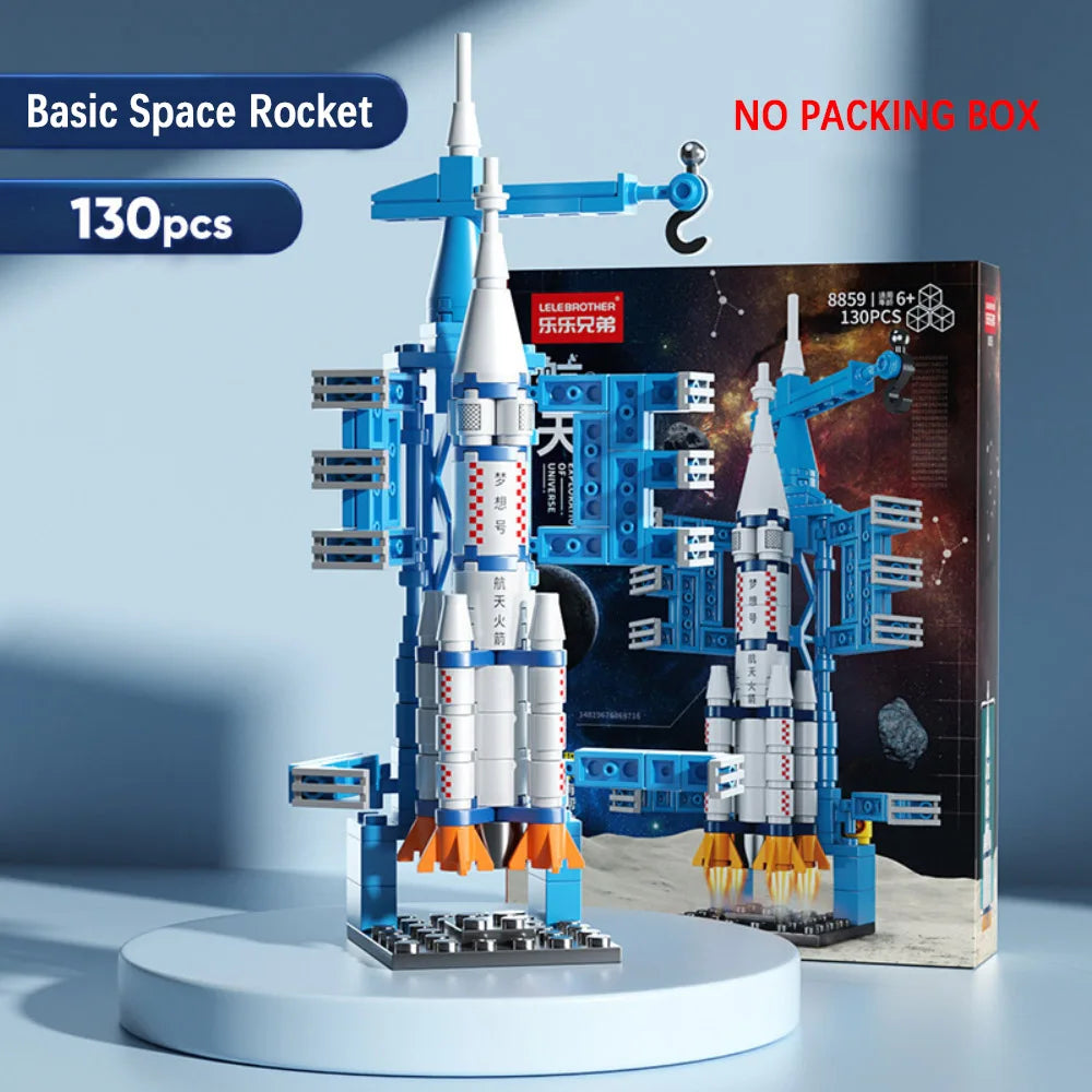 Space rocket model kit with packaging on a light blue background