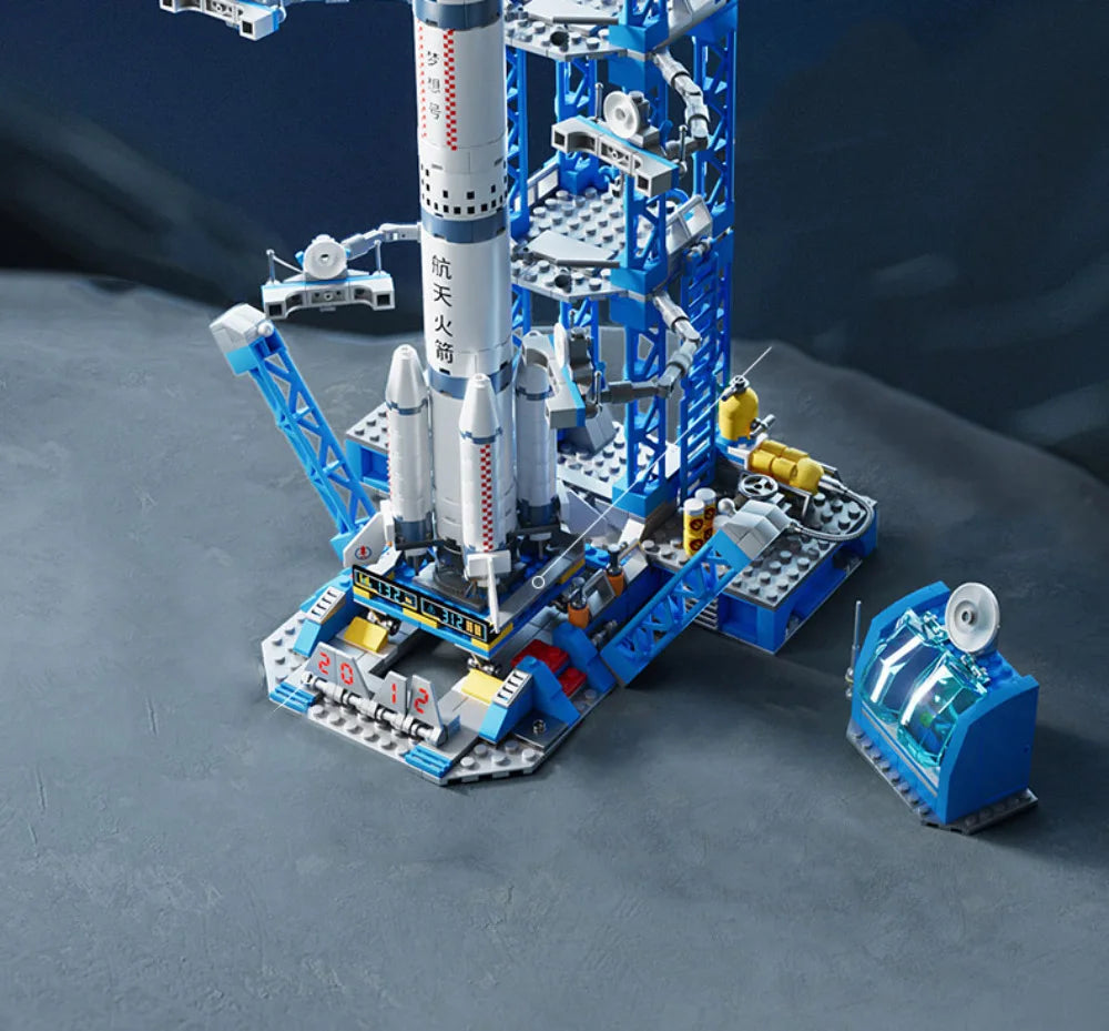 Toy rocket launch set on a dark surface