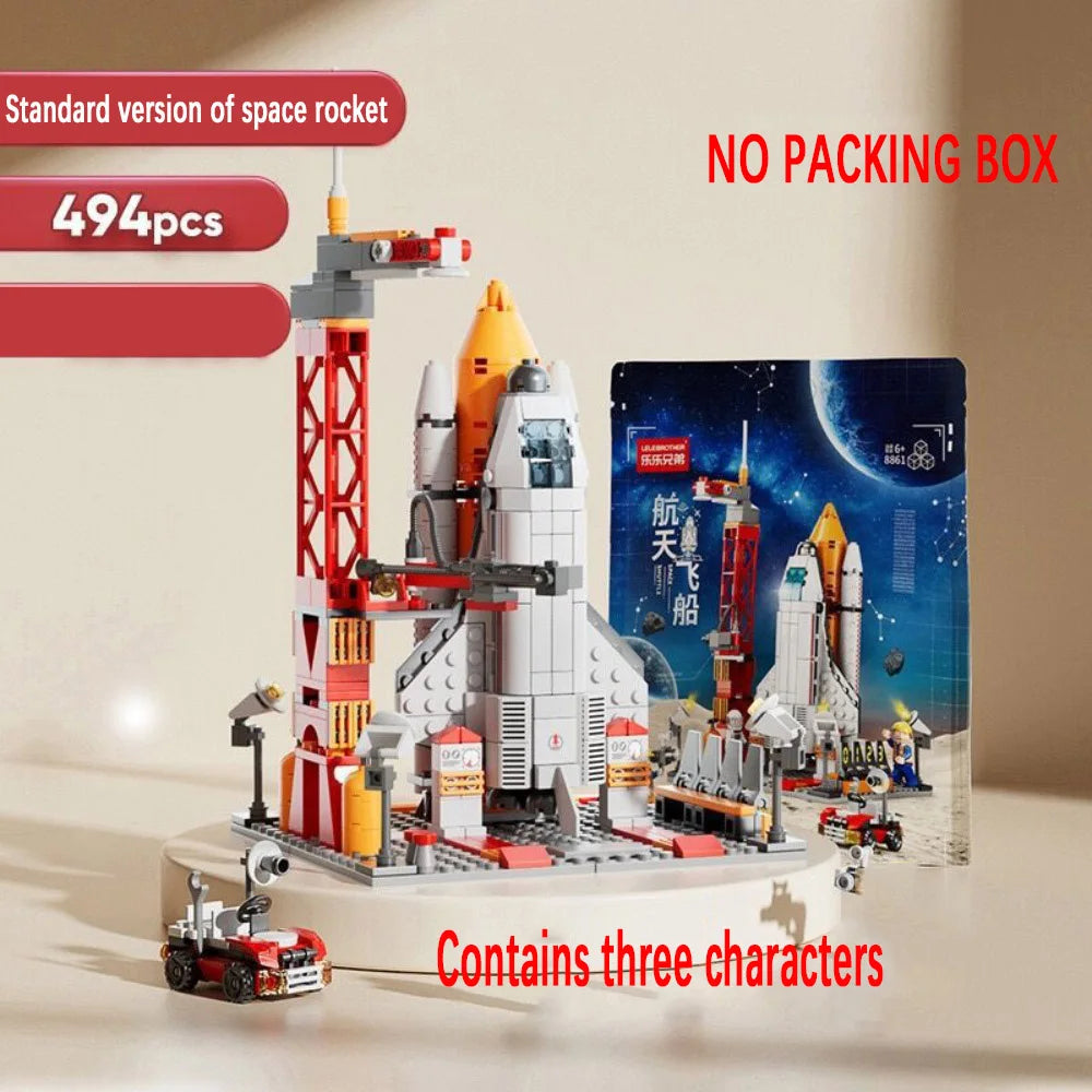 Space rocket model building kit with packaging on a beige background
