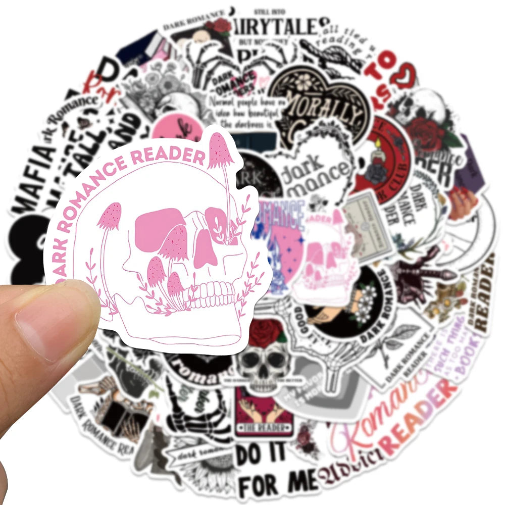 Dark romance reader sticker with skull design and text held by a hand, surrounded by other stickers.