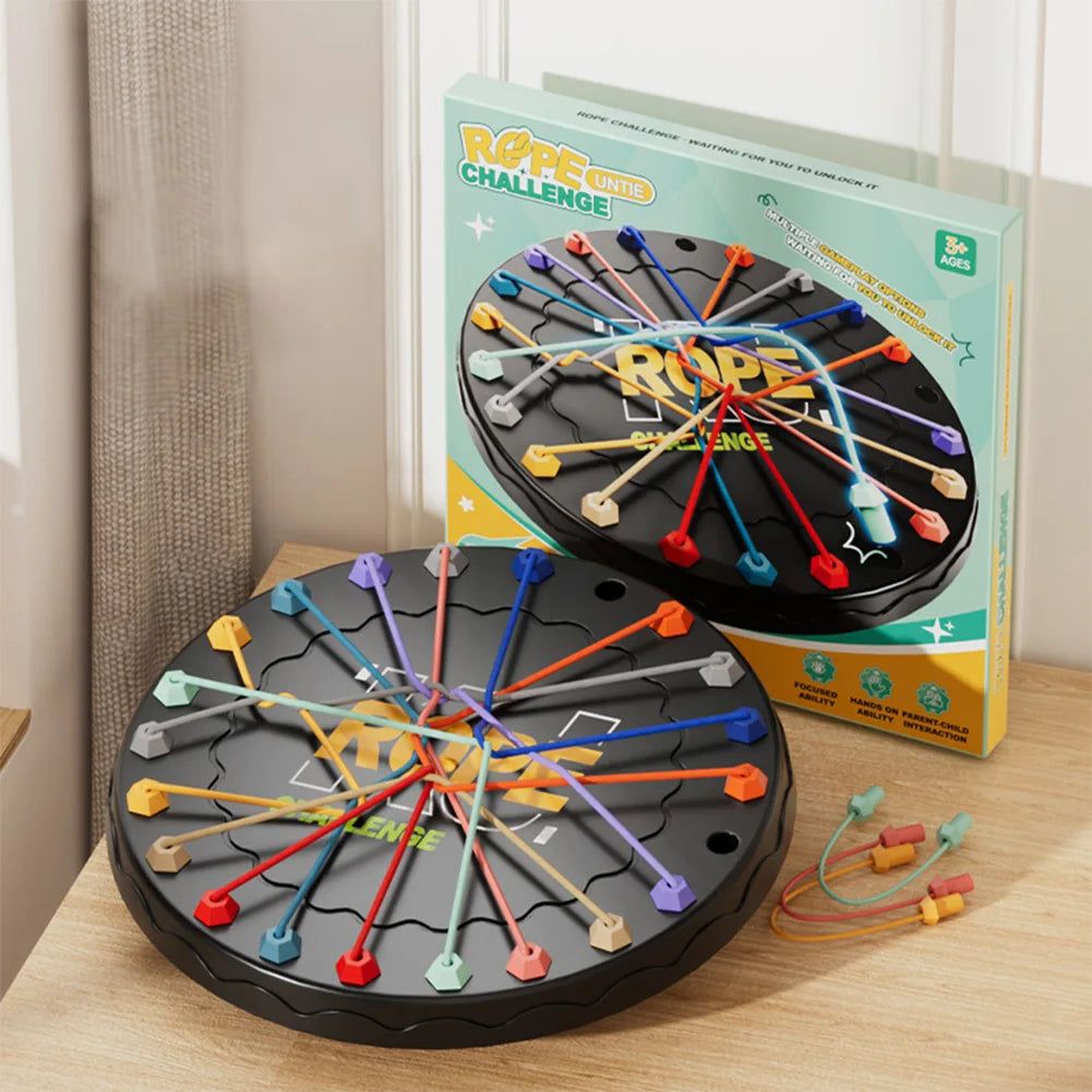 Two 'Rope Challenge' games with colorful ropes on a wooden surface, next to their packaging.