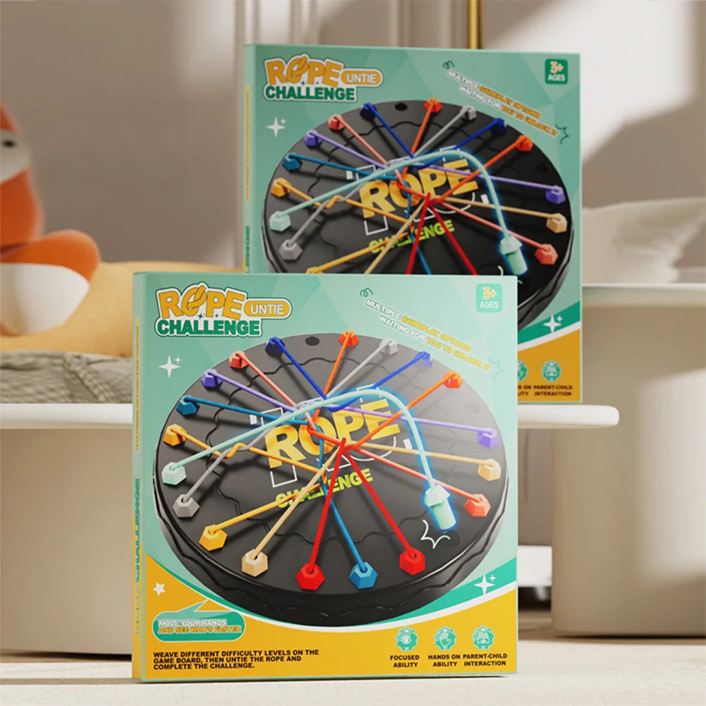 Two boxes of Rope Challenge game on a surface with a blurred background
