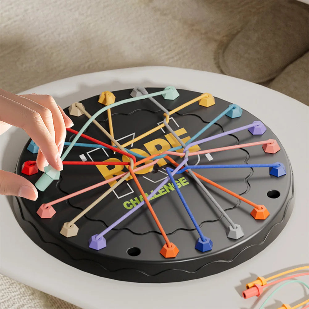 Board game with colorful pegs on a round board, hand interacting with it.