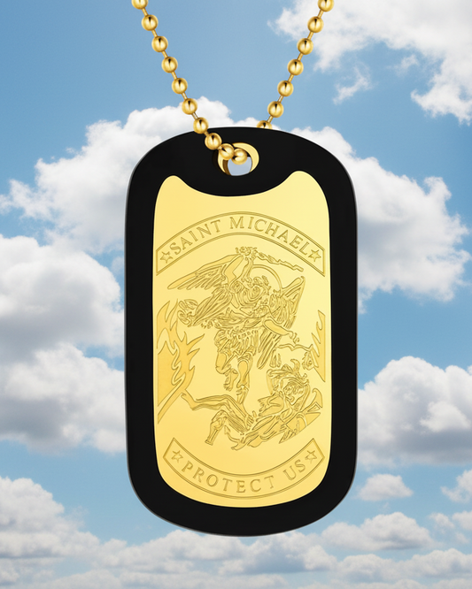 Gold dog tag with 'Saint Michael Protect Us' engraving against a cloudy sky background