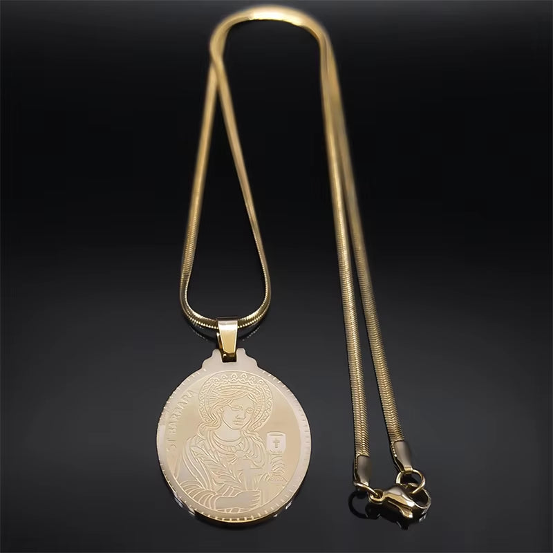 A gold-colored Saint Barbara pendant necklace with a flat chain, displayed showing pendant and whole flat chain on a dark background.