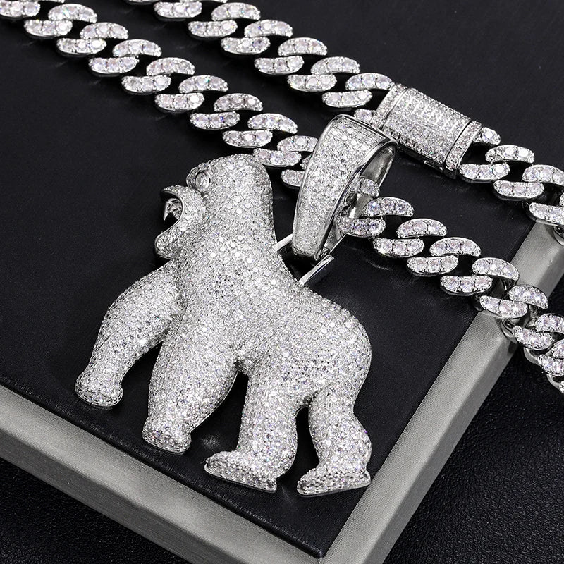 Silver gorilla pendant on a chain against a black background
