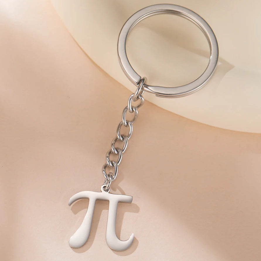 Keychain with pi symbol on a beige background