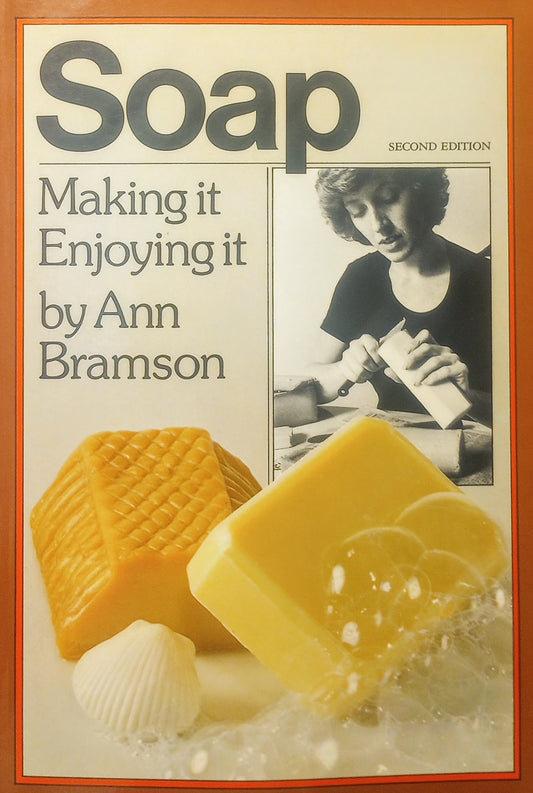 The cover of the book 'Soap: Making It, Enjoying It' by Ann Bramson features images of bar soaps with bubbles and a person molding soap.