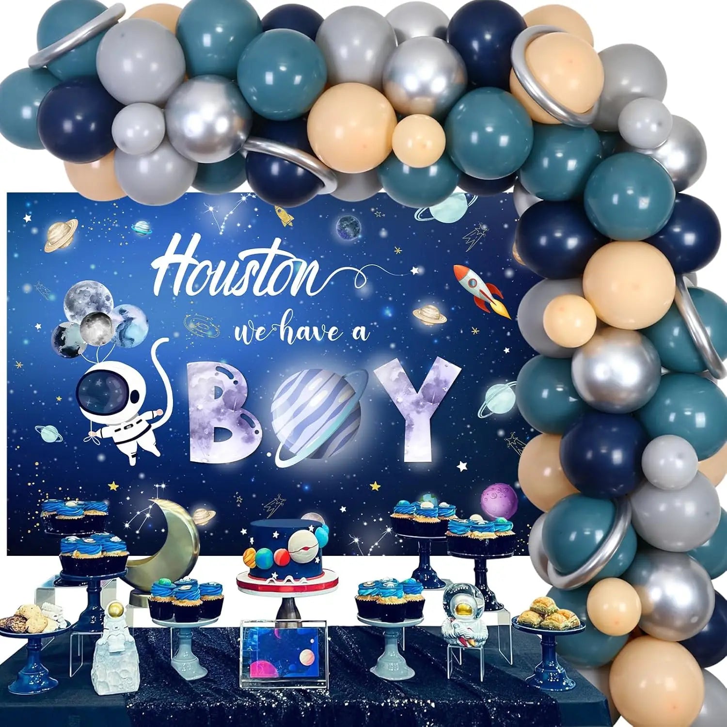 Space-themed baby shower setup with balloons, cake, and 'Houston we have a boy' backdrop.