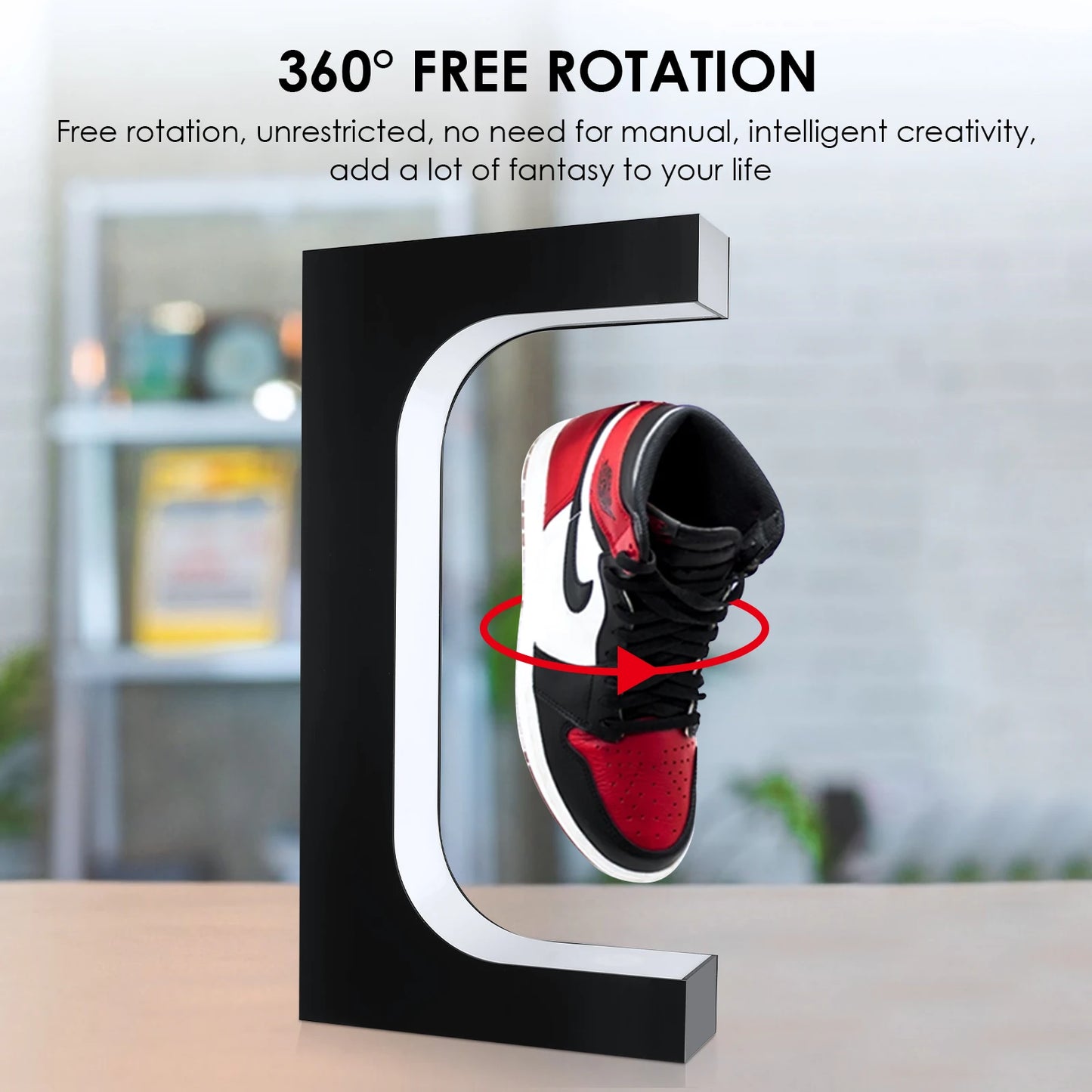 Black shoe display stand with a red and black sneaker, featuring text about 360-degree rotation.