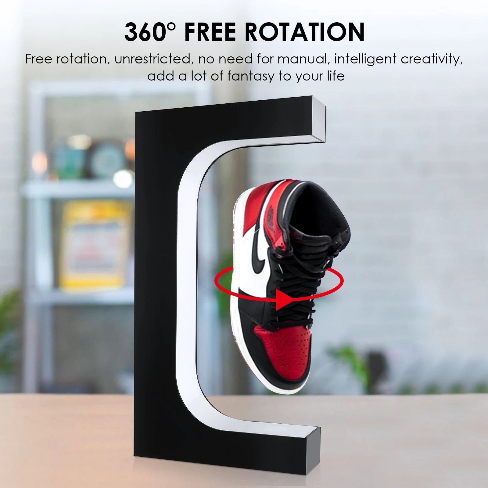 Black shoe display stand with a red and black sneaker, featuring text about 360-degree rotation.
