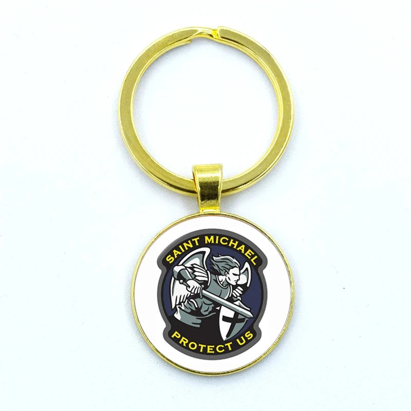 Gold keychain with Saint Michael design on a white background