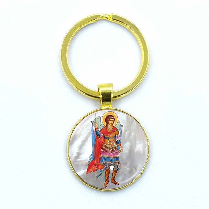 Gold keychain with a circular pendant featuring an illustration of a warrior in armor on a white background