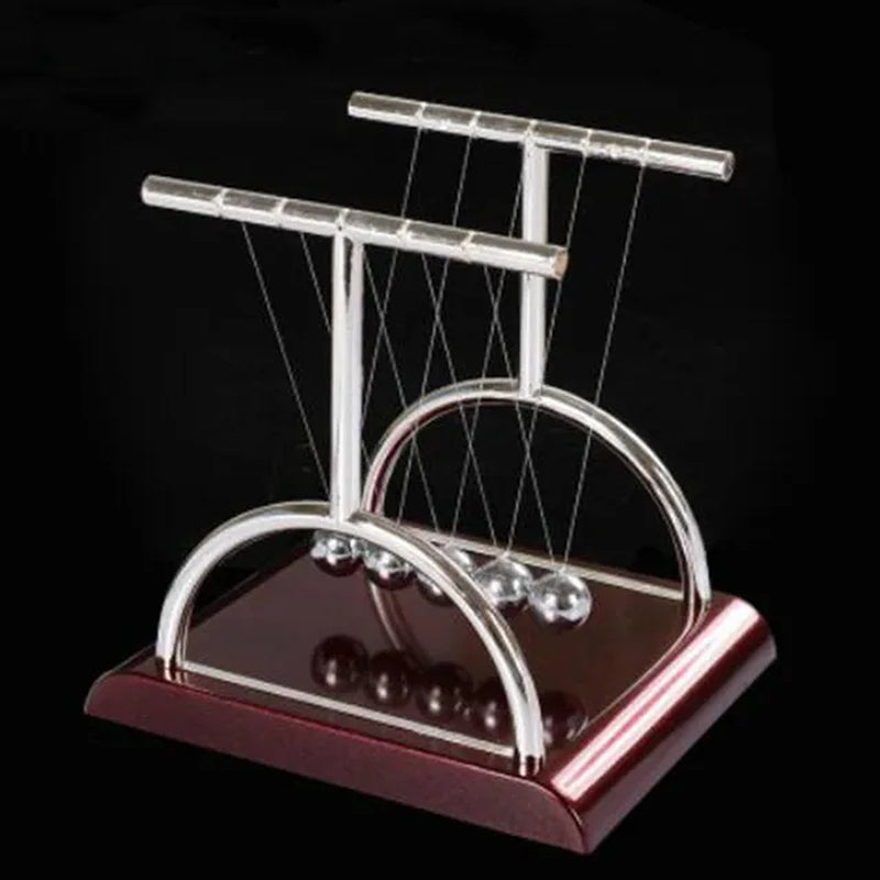 Arch style 'Table Newton Pendulum | Terrific Scientific Desk-Decoration' in motion.