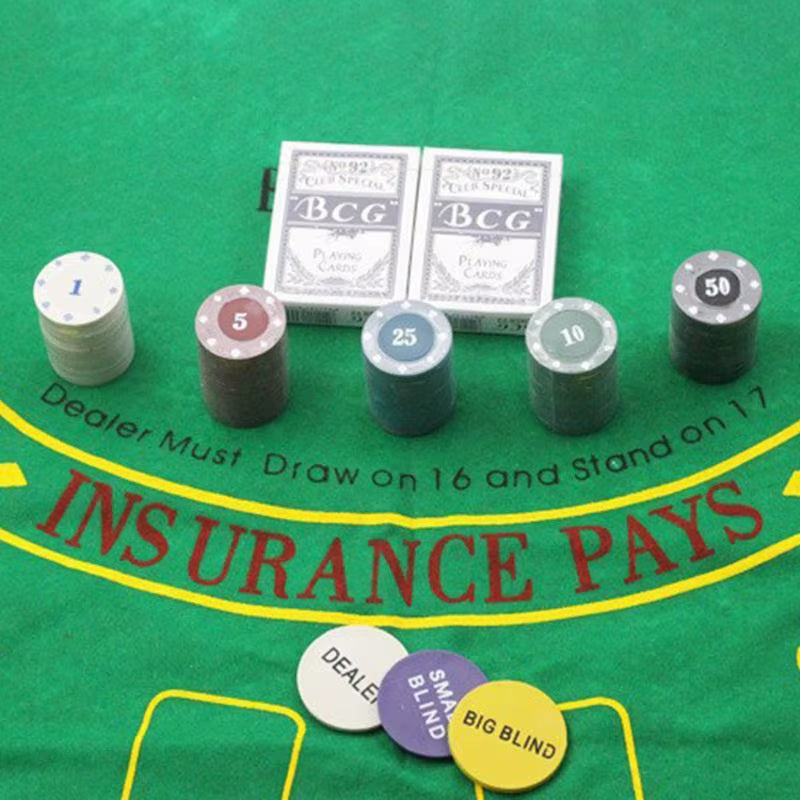 Texas Hold 'Em set displayed on included poker felt.