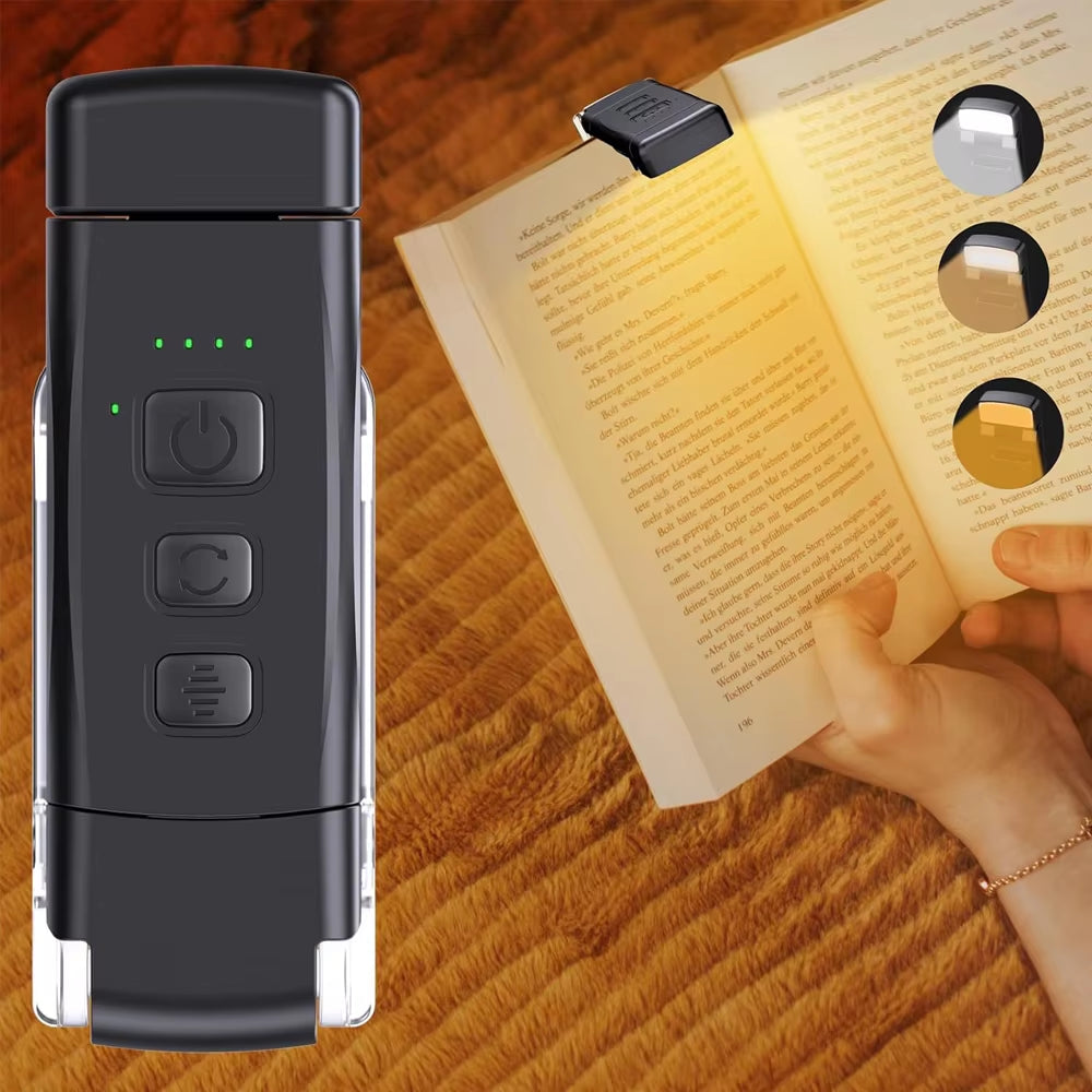 A black rechargeable reading light for bed with 3 color modes and 5 brightness levels, displayed next to an open book.