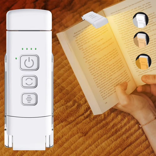 Clip-on book light attached to top of book with person reading.